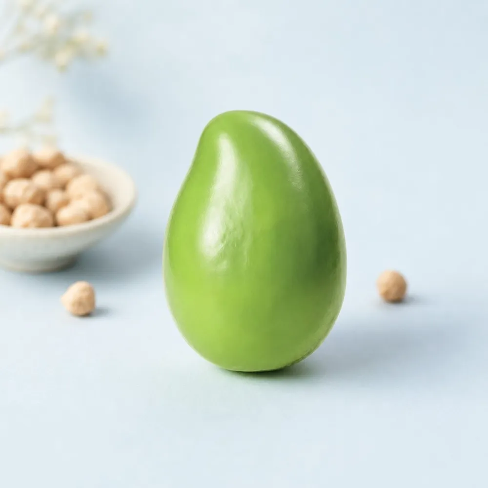 A smooth green mango squishy on pale blue card